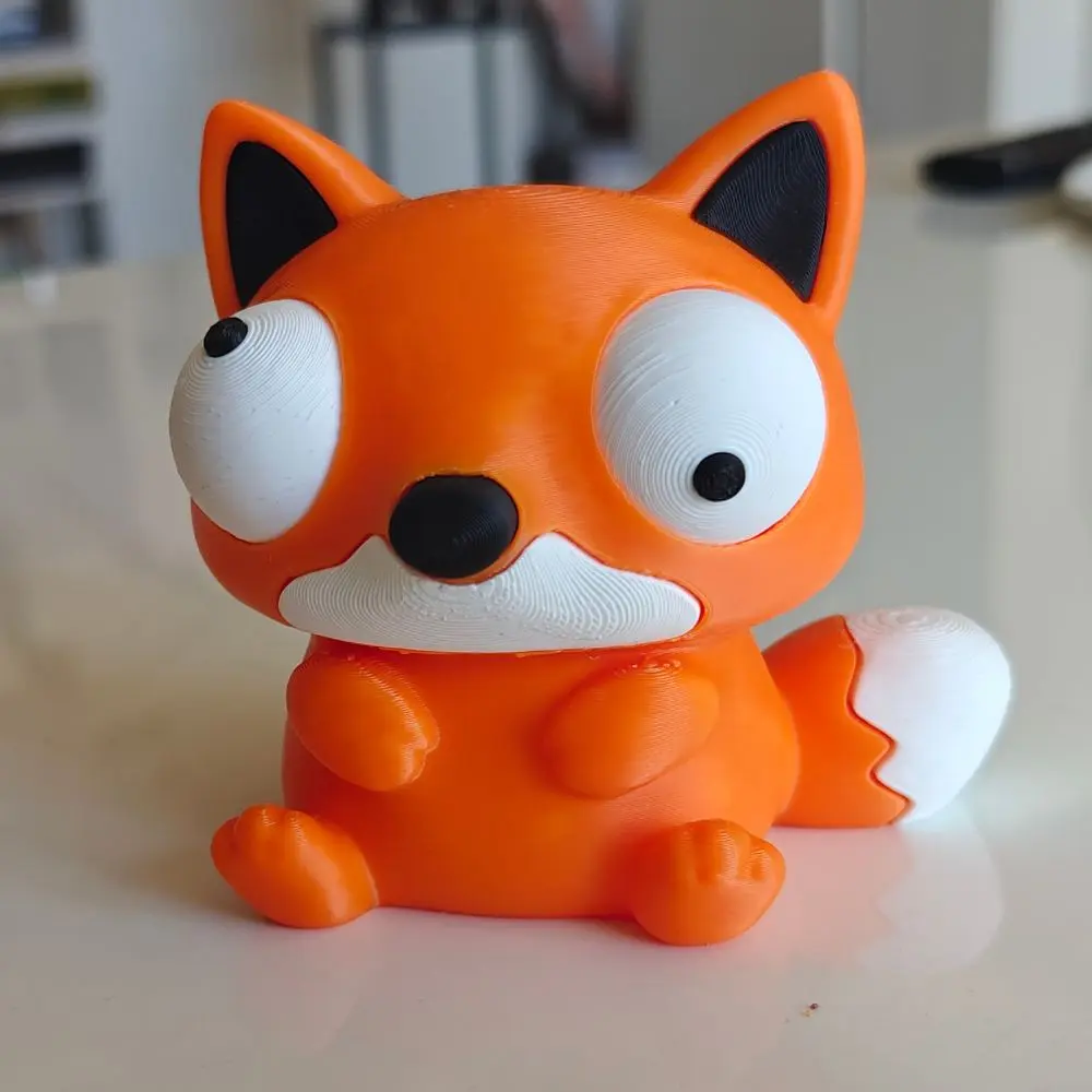 Narancssárga 3D nyomtatott róka figura vicces mozgatható szemekkel